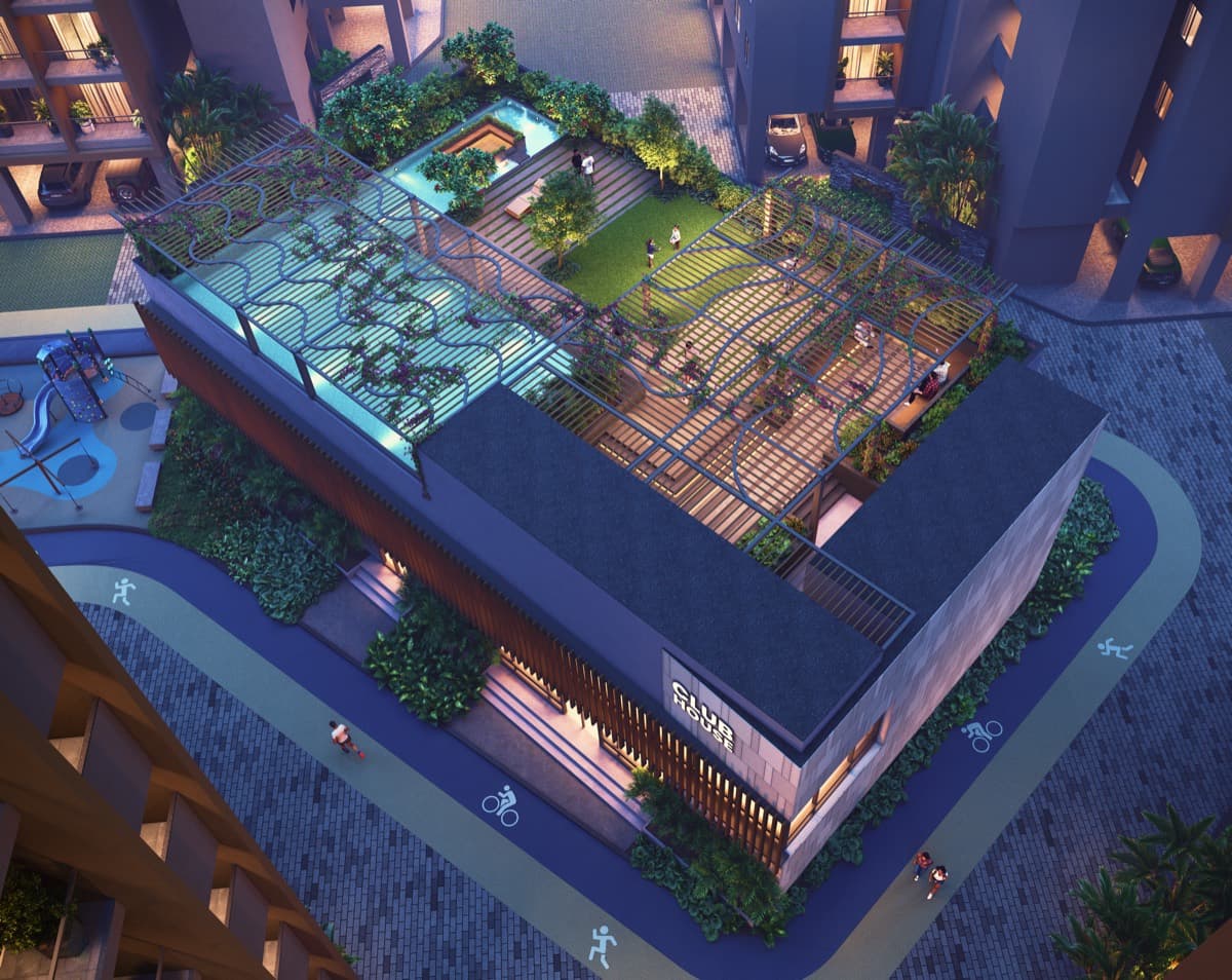 Aerial view of the clubhouse rooftop pool and gardens at night